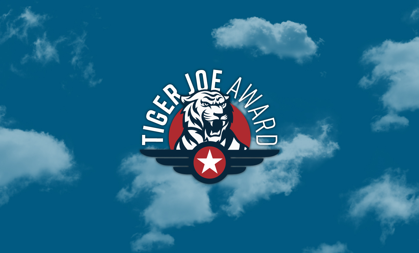 Tiger Joe Award logo in front of cloudy sky
