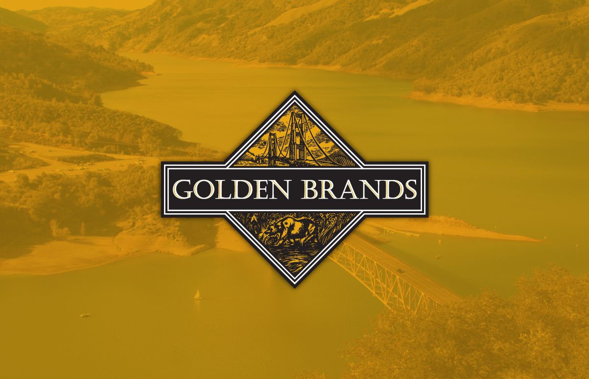 Golden Brands logo in front of yellow-opacity image of a bridge, mountains and body of water