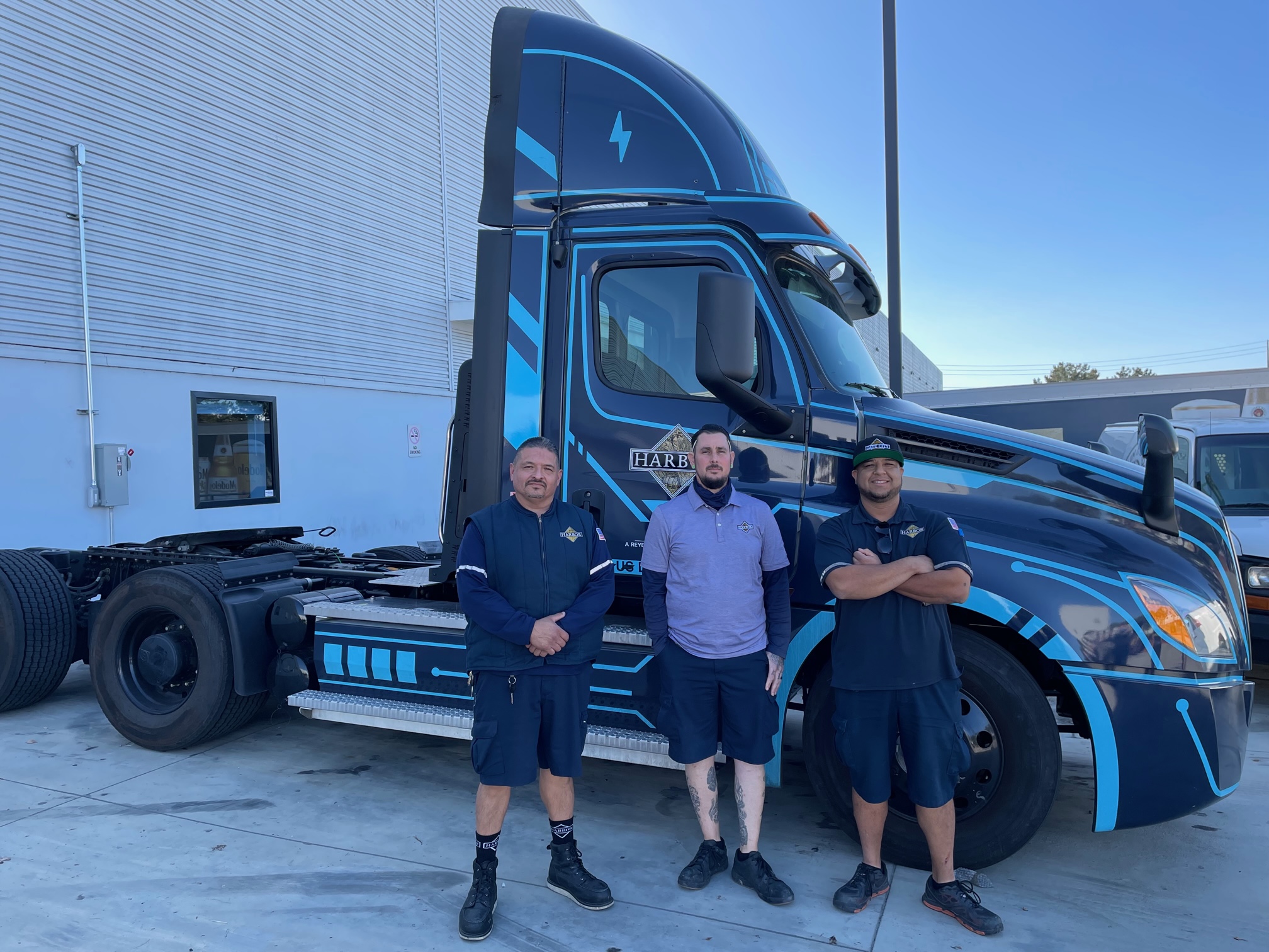 Reyes Beer Division team with the new all-electric Freightliner truck photo