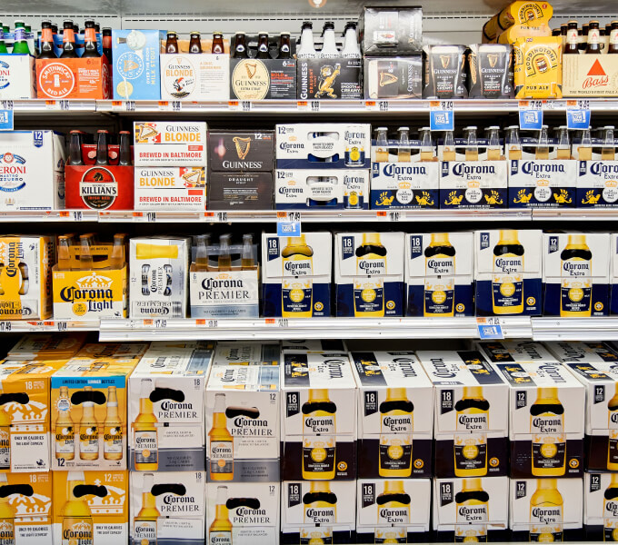 Shelf full of Corona Beer boxes